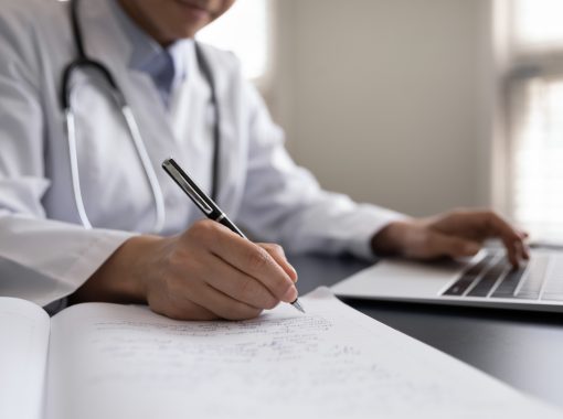 Crop,Close,Up,Indian,Woman,Doctor,In,White,Uniform,With